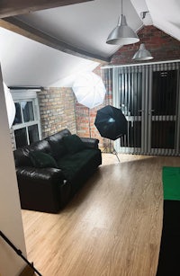 a living room with a couch and lights